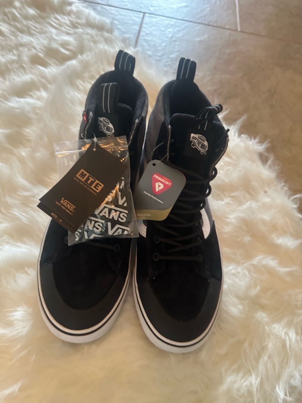Vans Men’s Black and White High-Top Skate Sneakers